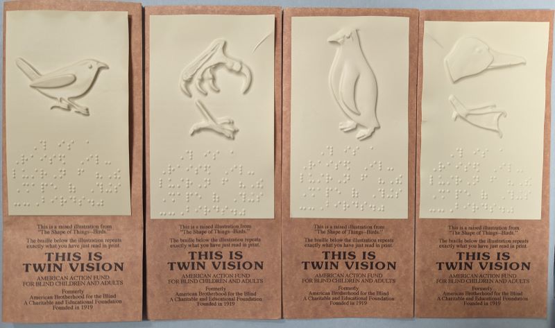 Four pamphlets embossed with a bird and Braille that says, “This is a raised illustration from ‘The Shape of Things – Birds